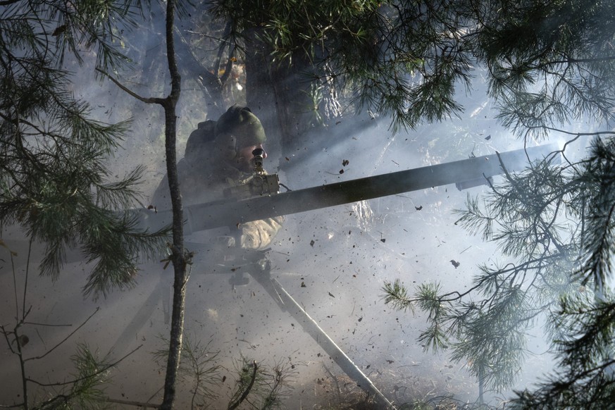 Soldiers of Ukraine&#039;s National Guard 1st brigade Bureviy (Hurricane) fire a recoilless cannon during combat training at a military training ground in the north of Ukraine Friday, Nov. 3, 2023. (A ...