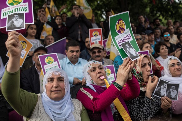 ISTANBUL, TURKEY - MAY 04: Supporters of the Pro-Kurdish Peoples' Democratic Party (HDP) shout slogans and hold pictures of HDP's nominated presidential candidate Selahattin Demirtas who is currently  ...