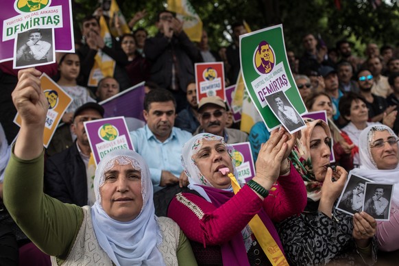 ISTANBUL, TURKEY - MAY 04: Supporters of the Pro-Kurdish Peoples' Democratic Party (HDP) shout slogans and hold pictures of HDP's nominated presidential candidate Selahattin Demirtas who is currently ...