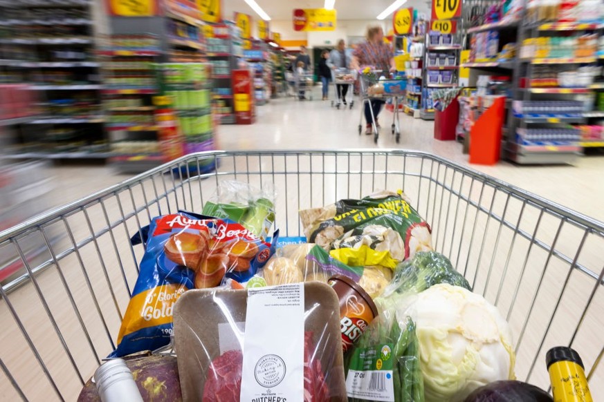 CARDIFF, WALES - OCTOBER 23: In this photo illustration, a trolly of shopping filled with produce used in a traditional Sunday roast dinner is seen on October 23, 2022 in Cardiff, Wales. The cost of a ...