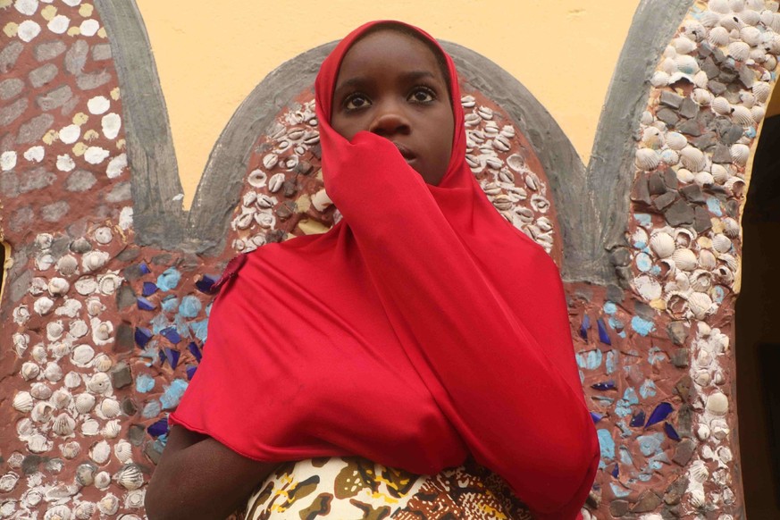 RECORD DATE NOT STATED A young girl watching worshippers take part in the Osun-Osogbo festival, in Osogbo, the capital of southwest Nigeria s Osun State. Osun-Osogbo festival presents an opportunity f ...