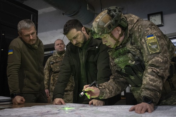 FILE - Ukrainian President Volodymyr Zelenskyy, Commander of Ukraine&#039;s Ground Forces Col.-Gen. Oleksandr Syrsky, right, and Roman Mashovets, deputy head of the Presidential Office, look at a map  ...