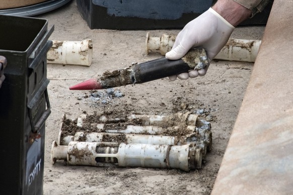 ARCHIVE - June 23, 2022, USA, Tooele: HANDOUT - In this image provided by the US Air National Guard, US Air Force National Guard Explosive Ordnance Disposal technicians prepare...