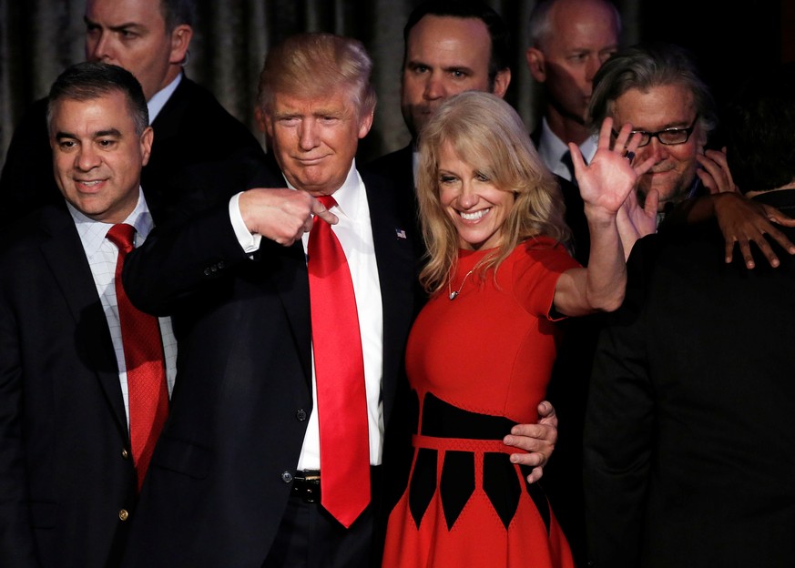 FILE PHOTO - Donald Trump and his campaign manager Kellyanne Conway greet supporters during his election night rally in Manhattan, New York, U.S., November 9, 2016. REUTERS/Mike Segar/File Picture