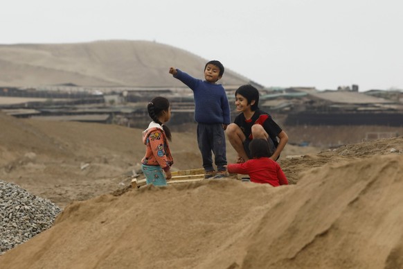 June 2, 2021, Lima, Peru: Children play in the Nueva Punta Hermosa housing association, south of Lima Lima Peru - ZUMAb195 20210602_zip_b195_006 Copyright: xMarianaxBazox