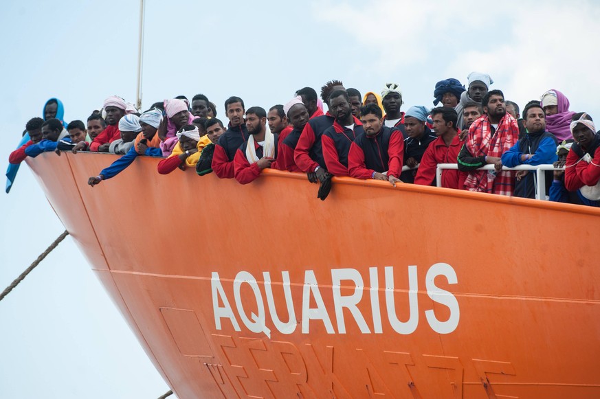 Italy: Migrants disembark during the G7 Migrants disembark from the Aquarius ship of the NGO SOS Mediterranee - Doctors without borders, coming from Libya, Nigeria, Mali, Morocco, Pakistan, Bangladesh ...