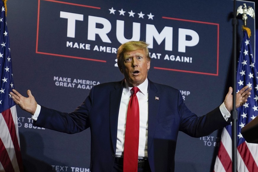 Former President Donald Trump reacts to the crowd as he arrives at a campaign rally, Thursday, April 27, 2023, in Manchester, N.H. (AP Photo/Charles Krupa)