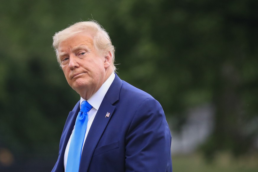 President Donald Trump walks across the South Lawn of the White House in Washington, Saturday, July 11, 2020. Trump was returning from a visit to nearby Walter Reed National Military Medical Center in ...