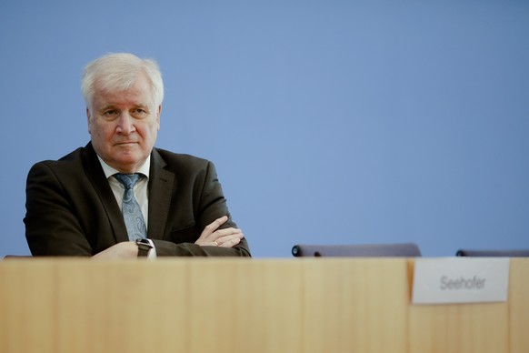 German Interior Minister Horst Seehofer attends a news conference about structures of the Federal Office of Civil Protection and Disaster Assistance in Berlin, Germany, Wednesday, March 17, 2021. (AP  ...