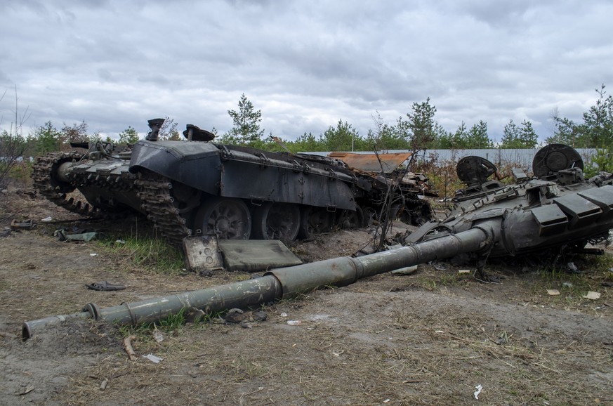 IRPIN, UKRAINE - Broken tanks, combat vehicles and other burnt military equipment of the Russian invaders in Irpin,The russian tank burned by the Ukrainian army. Kiev region Model Released Property Re ...