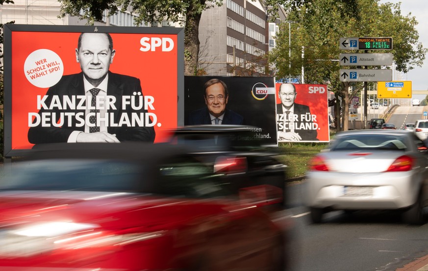 BREMEN, GERMANY - SEPTEMBER 22: Election campaign billboards showing Olaf Scholz, chancellor candidate of the German Social Democrats (SPD), and Armin Laschet, chancellor candidate of the Christian De ...