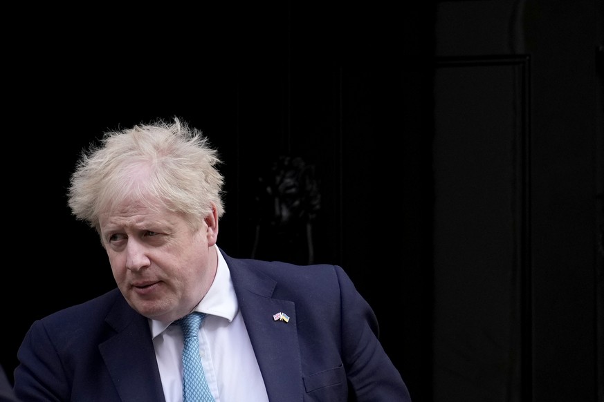FILE - British Prime Minister Boris Johnson leaves 10 Downing Street to attend the weekly Prime Minister's Questions at the Houses of Parliament, in London, Wednesday, March 9, 2022. Johnson was dealt ...