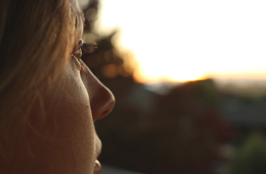 Beautiful woman looking outside