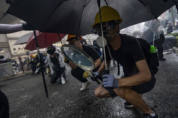 August 25, 2019, Tseun Wan, Hong Kong, China: A peaceful march turned into a riot when pro democracy protesters set up blockades in the middle of Yueng Uk road, police fired tear gas, protesters threw ...