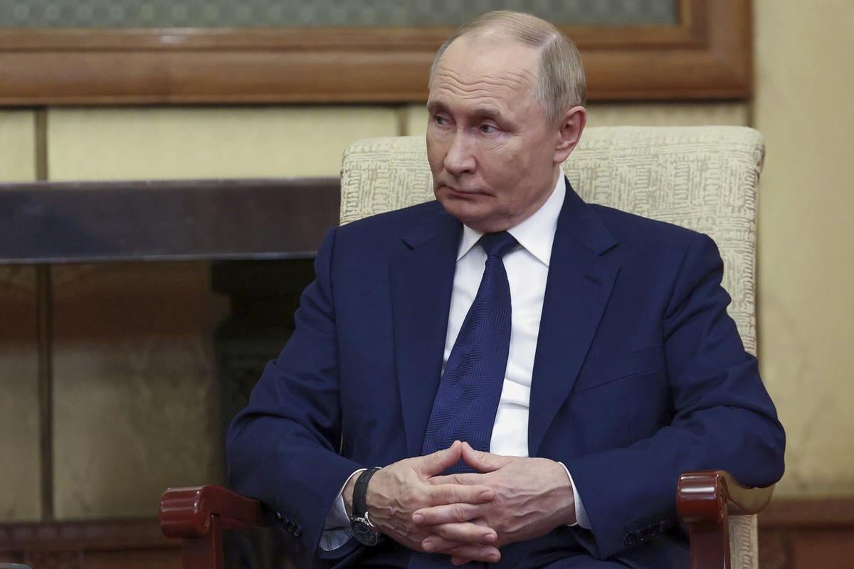 Russian President Vladimir Putin listens to Serbian President Aleksandar Vucic during their meeting at Diaoyutai State Guesthouse in Beijing, China, Tuesday, Sept. 2, 2025. (Alexander Kazakov,Sputnik, ...