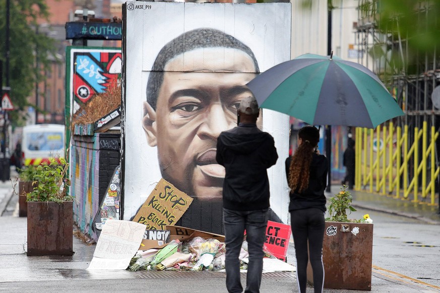 Black Lives Matter protests Members of the public stop to view a mural of George Floyd by the street artist Akse in Stevenson Square in Manchester s Northern Quarter. The mural is in memory of George  ...