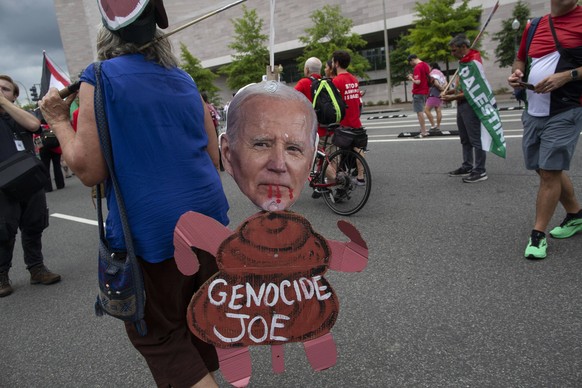 July 24, 2024, Washington, District Of Columbia, USA: A demonstrator carries a puppet of US president Joe Biden with Genocide Joe written on it while joining in a demonstration. Pro-Palestinian demons ...