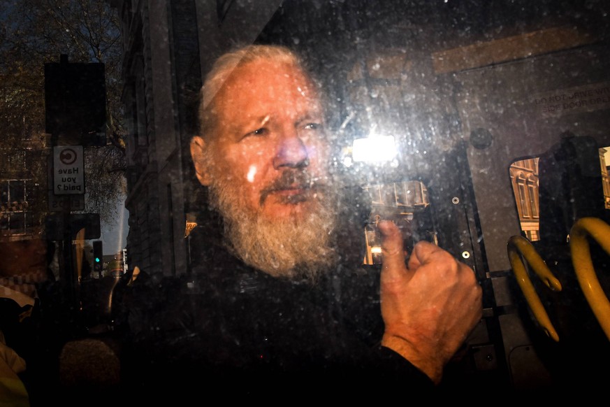 April 11, 2019 - London, England, United Kingdom - Wikileaks founder Julian Assange makes his way into the Westminster Magistrates Court after being arrested this morning by Metropolitan Police, on be ...