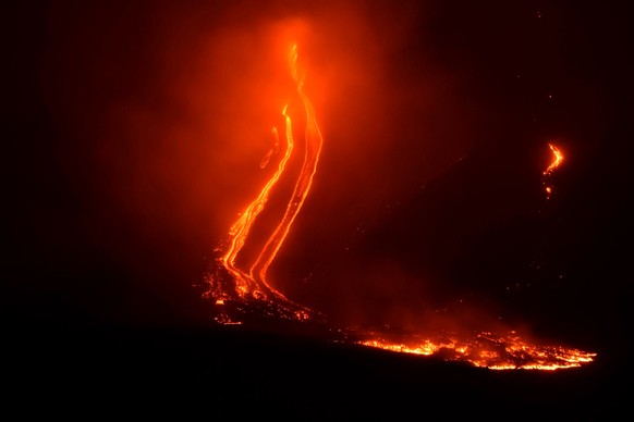 Mount Etna volcano spews lava during an eruption early Tuesday Dec. 25, 2018. Italy's Catania airport is reopening after an ash cloud from Mount Etna's latest eruptions forced it to shut down. The air ...