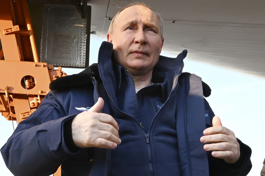 Russian President Vladimir Putin gets off a Tu-160M strategic bomber after a flight in Kazan, Russia, Thursday, Feb. 22, 2024. (Dmitry Azarov, Sputnik, Kremlin Pool Photo via AP)