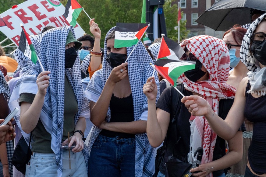 April 29, 2024, New York, New York, USA: Protesters wearing keffiyehs and waving Palestinian flags. Pro-Palestine students living in the Gaza Solidarity encampment on Columbia University grounds were  ...