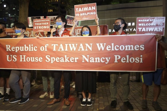 Supporters hold a banner outside the hotel where U.S. House Speaker Nancy Pelosi is supposed to be staying in Taipei, Taiwan, Tuesday, Aug 2, 2022. U.S. House Speaker Nancy Pelosi was believed headed  ...