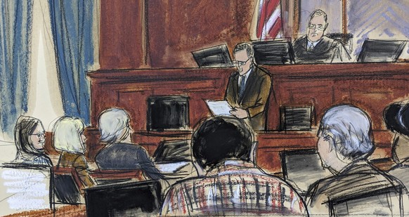 In this courtroom sketch, E. Jean Carroll, second from left, listens as courtroom deputy Andrew Mohan, center, reads the verdict in Manhattan federal court, Tuesday, May 9, 2023, in New York. A jury h ...