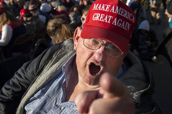 MAGA MAN: December 5, 2020, Valdosta, Georgia, USA: Elderly white male wearing a Make America Great Again MAGA red baseball cap, angrily yells and points at media. The Trump supporter from central Geo ...