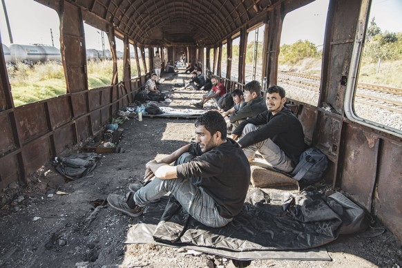 Refugees And Migrants Heading To The Greek Borders Male asylum seekers as seen in abandoned old train carriages near Thessaloniki city on their way to follow the Balkan Route towards Northern Macedoni ...