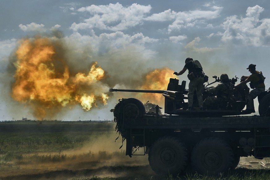 FILE - Ukrainian soldiers fire a cannon near the eastern city of Bakhmut in the Donetsk region of Ukraine, Monday, May 15, 2023. As the Kremlin watches for more signs of crumbling Western support for  ...