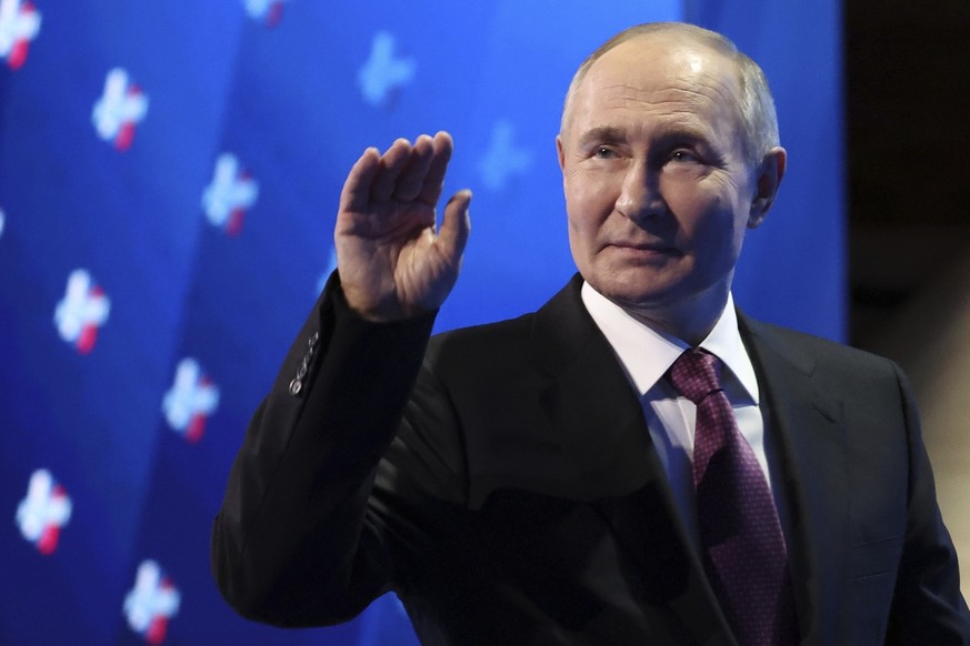 Russian President Vladimir Putin waves as he leaves a tribune after delivering his speech at the annual congress of the Russian Union of Industrialists and Entrepreneurs in Moscow, Russia, Thursday, A ...