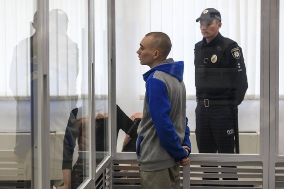 Russian Soldier Pleads Guilty In Kyiv Court On Charge Of Killing Civilian Russian soldier Vadim Shishimarin, 21, suspected of violations of the laws and norms of war, inside a cage during a court hear ...
