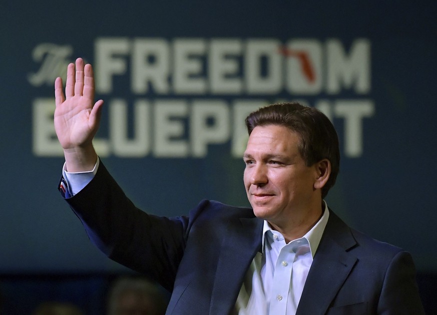 Florida Gov. Ron DeSantis waves to the crowd as he attends an event Friday, March 10, 2023, in Davenport, Iowa. (AP Photo/Ron Johnson)