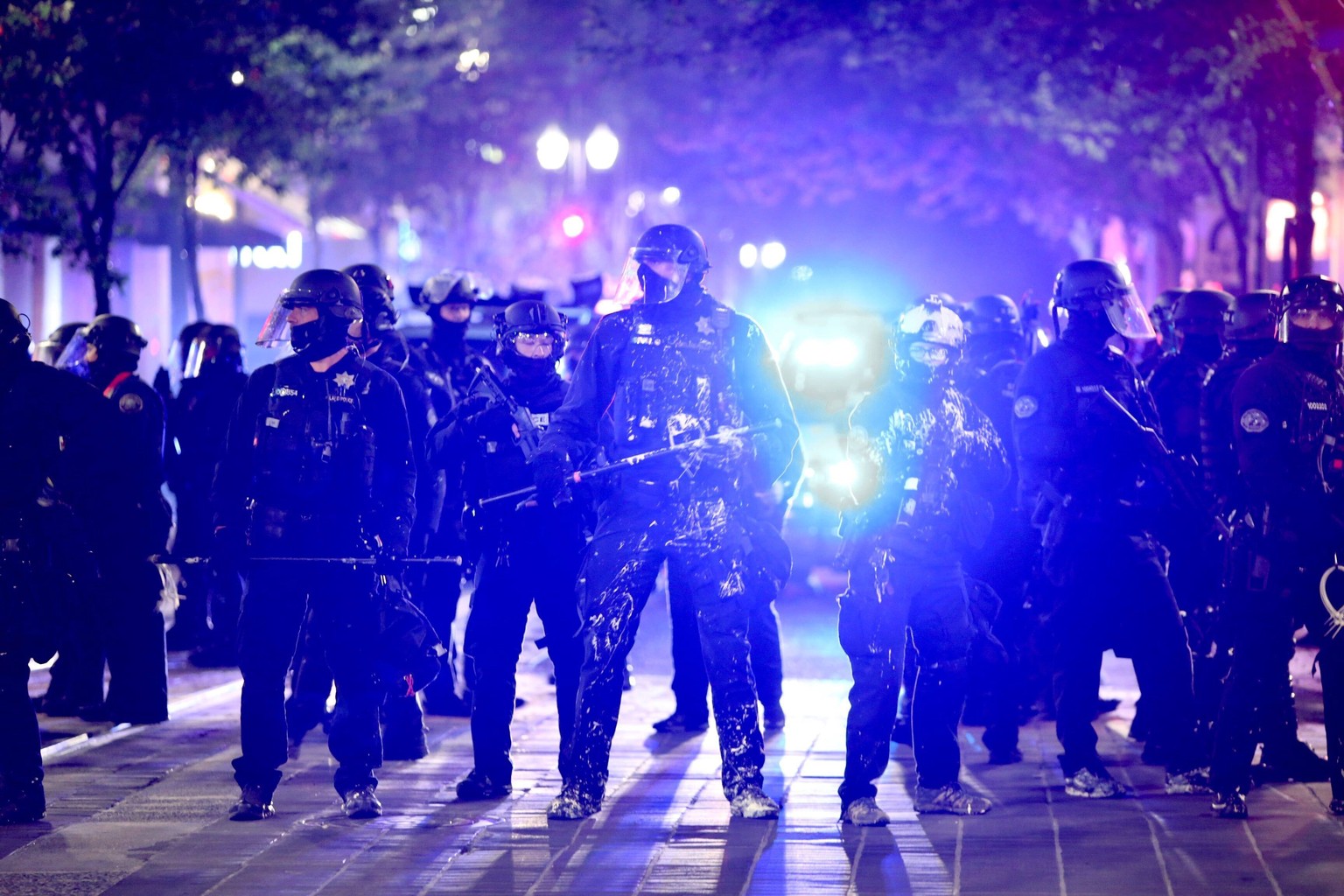 Portland Police and protesters clashed in a demonstration in downtown Portland, Wednesday, Aug. 12, 2020. Officers used tear gas to break up the crowd of several hundred people who gathered near the M ...