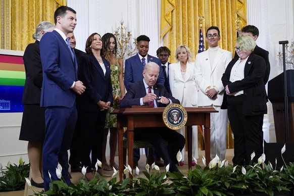 FILE - President Joe Biden signs an executive order at an event to celebrate Pride Month in the East Room of the White House, June 15, 2022, in Washington. Biden plans to sign legislation this coming  ...