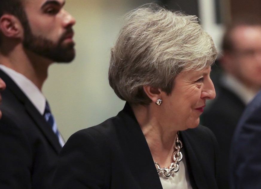 European Commission President Jean-Claude Juncker, right, speaks with British Prime Minister Theresa May prior to a meeting at EU headquarters in Brussels, Wednesday, Feb. 20, 2019. European Commissio ...