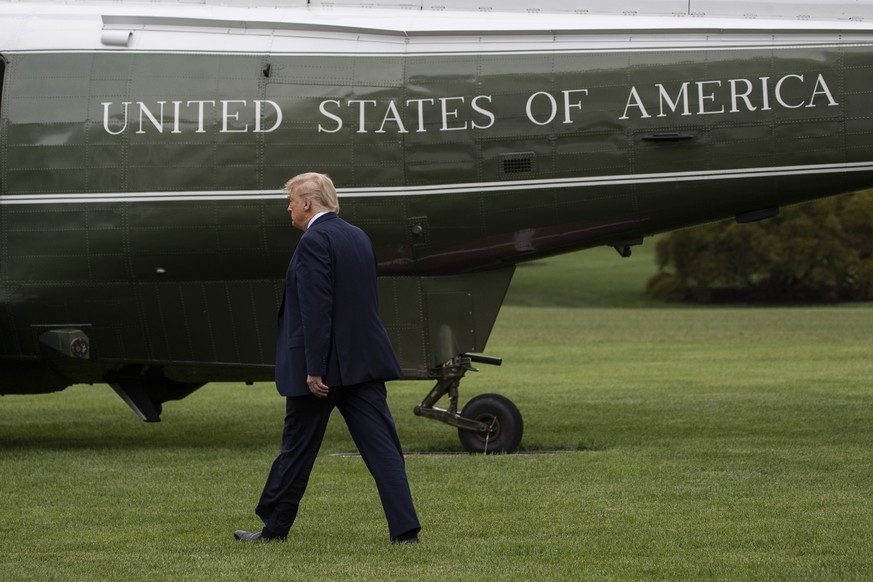 President Donald Trump walks to Marine One as he departs the White House, Friday, July 24, 2020, in Washington. Trump is en route to Trump National Golf Club in Bedminster, N.J., (AP Photo/Alex Brando ...