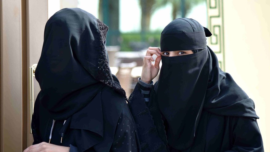 (151212) -- RIYADH, Dec. 12, 2015 -- Women walk out of a polling station after casting their votes for municipal elections in Riyadh, Saudi Arabia, Dec. 12, 2015. More than 1.4 million people are elig ...
