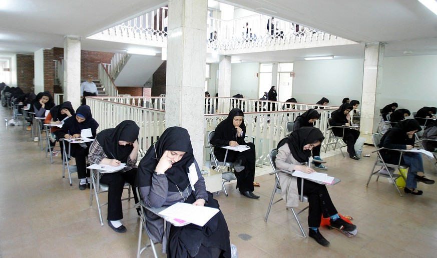 Iranian high school students sit for their university entrance examination in Tehran on June 25, 2009. Iran has jailed more than 140 political activists, journalists and university lecturers since the ...