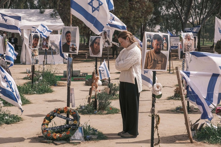 February 25, 2024, Kibbutz Reim, Israel: Visitors join grieving families to pay respect to the victims of the October 7th, 2023, Nova Music Festival Massacre near Kibbutz Reim. 364 festival participan ...