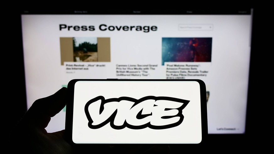 Person holding smartphone with logo of broadcasting company Vice Media LLC on screen. Stuttgart, Germany - 07-31-2022: Person holding smartphone with logo of broadcasting company Vice Media LLC on scr ...