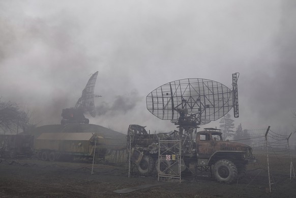 Smoke rise from an air defense base in the aftermath of an apparent Russian strike in Mariupol, Ukraine, Thursday, Feb. 24, 2022. Russian troops have launched their anticipated attack on Ukraine. Big  ...