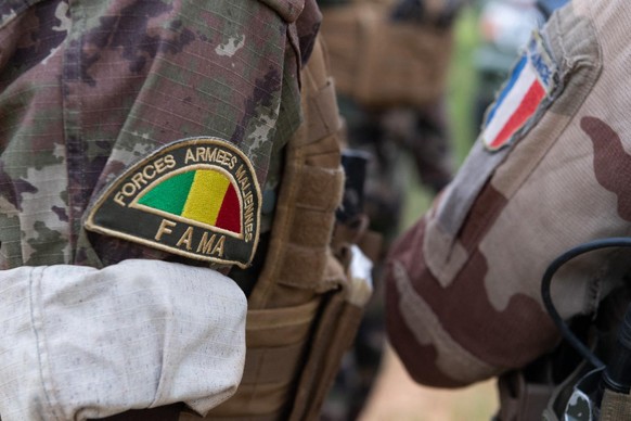 Handout undated file photo of French and Malian troops operating in Mali. President Macron held a news conference Thursday morning at the Elysee Palace, after African and Western leaders met in Paris  ...