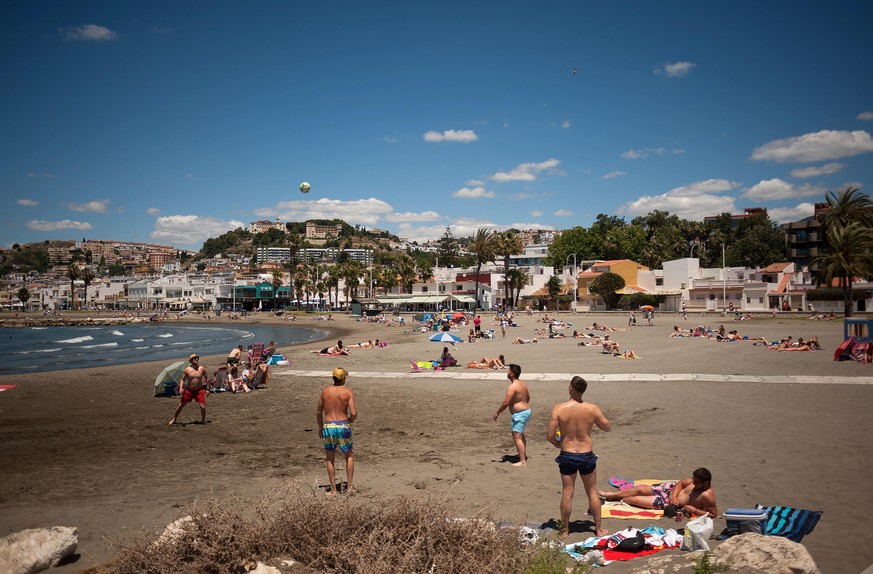 June 13, 2020, Malaga, Spain: People enjoy the weather on a sunny day at Pedregalejo beach amid easing of restrictions caused by COVID-19 outbreak..Most cities in Spain are in phase three where people ...