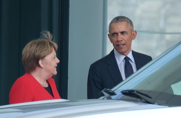BERLIN, GERMANY - APRIL 05: Former U.S. President Barack Obama and German Chancellor Angela Merkel chat moments before his departure after meeting with her at the Chancellery on April 5, 2019 in Berli ...