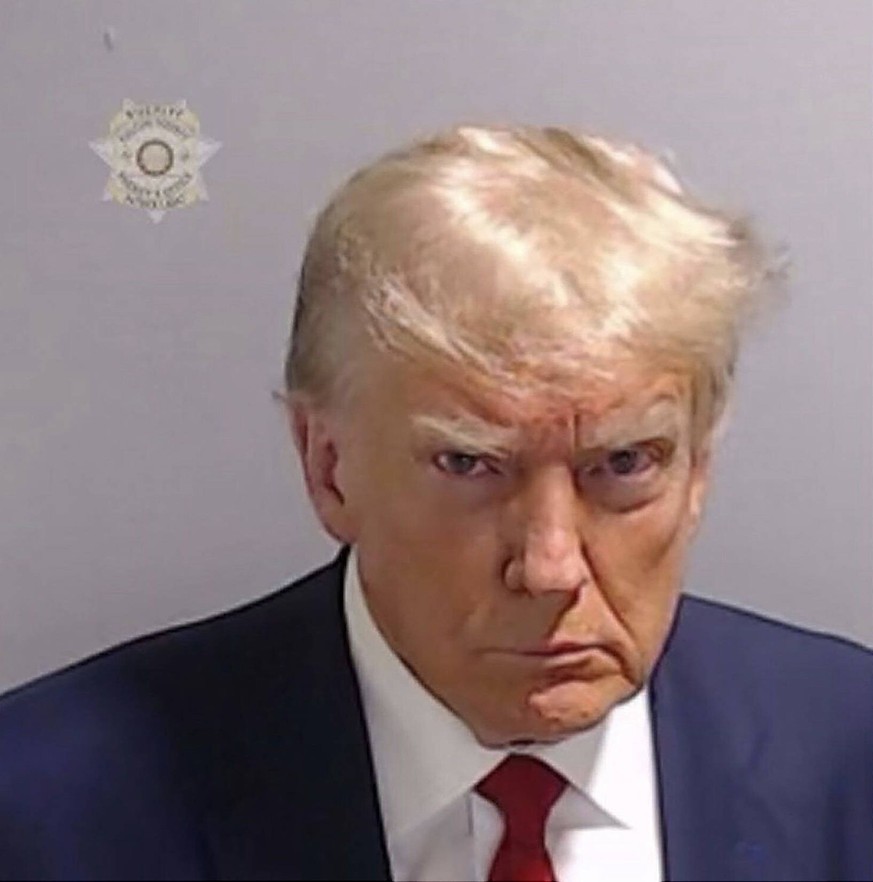 August 24, 2023, Atlanta, Georgia, USA: Booking photo of Former President DONALD TRUMP, in a Fulton County Jail booking photo made available by the . Trump has been indicted by a Fulton County Grand J ...