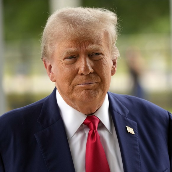 Republican presidential nominee former President Donald Trump arrives at the Palm Beach County Supervisor of Elections, Wednesday, Aug. 14, 2024, in West Palm Beach, Fla., to vote early in person in t ...