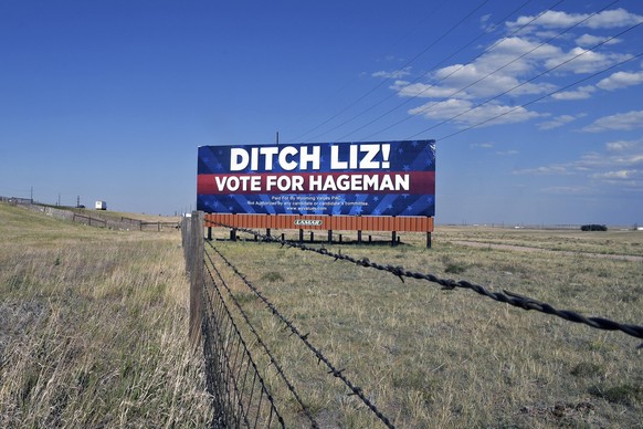 A billboard outside Cheyenne, Wyo., on July 19, 2022, calls on voters to cast their ballots for Harriet Hageman, who is running against incumbent Rep. Liz Cheney, R-Wyo., in the Republican primary ele ...
