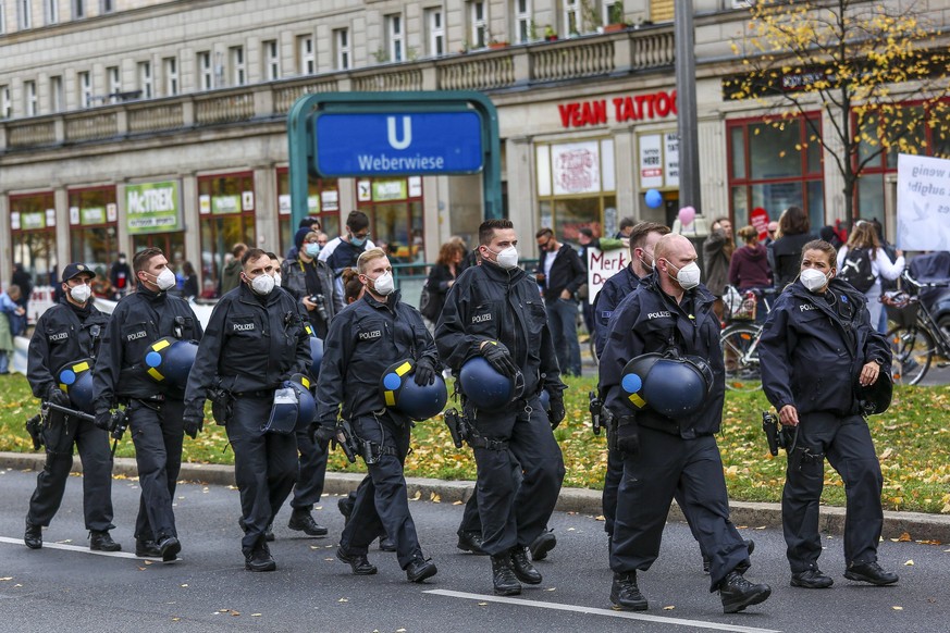 October 25, 2020, Berlin, Berlin, Germany: People demonstrate against the coronavirus restrictions along Karl-Marx-Allee in Berlin, Germany, October 25, 2020. Some 2000 participants, among them corona ...