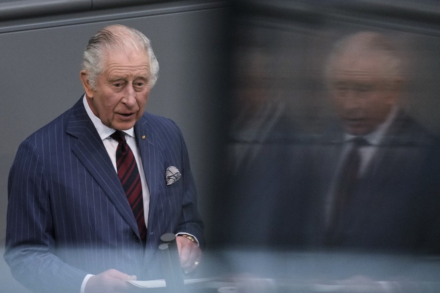 Britain&#039;s King Charles III, left, addresses the Bundestag, Germany&#039;s Parliament, in Berlin, Thursday, March 30, 2023. King Charles III arrived Wednesday for a three-day official visit to Ger ...
